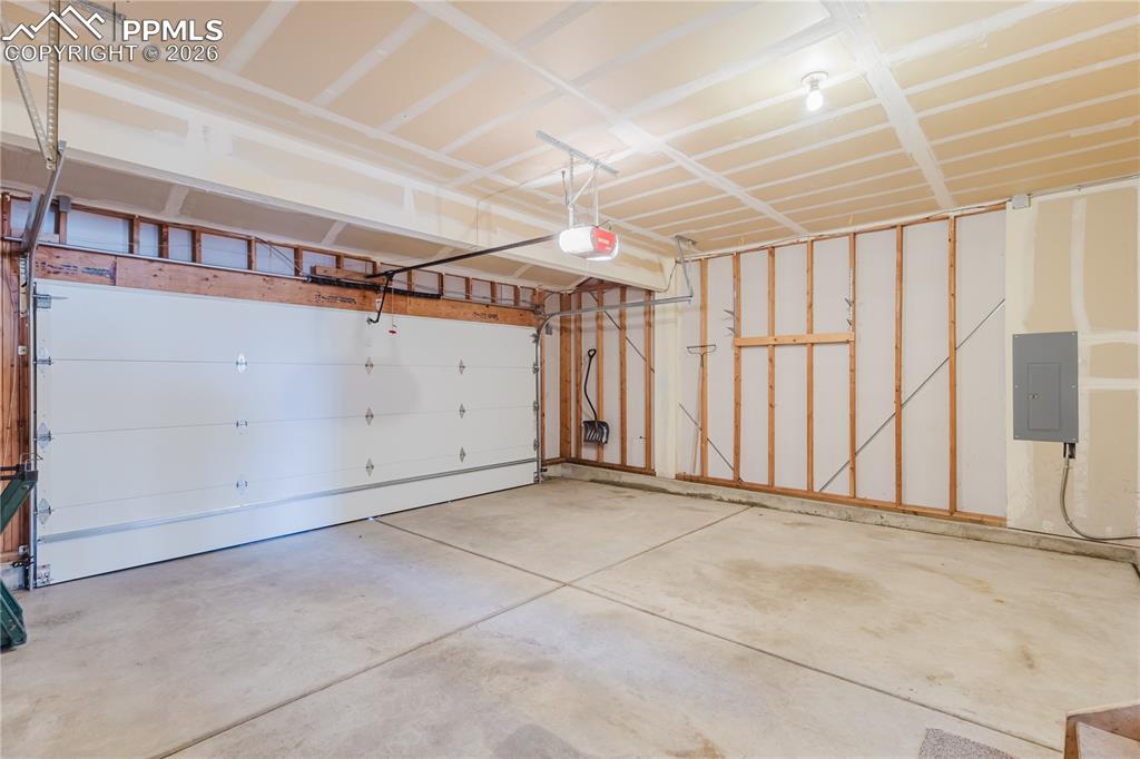 Image 47 of 50: Finished Basement room featuring dark carpet and baseboards