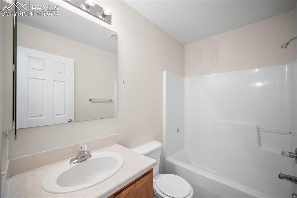 Image 20 of 36: Upstairs Hall Bath