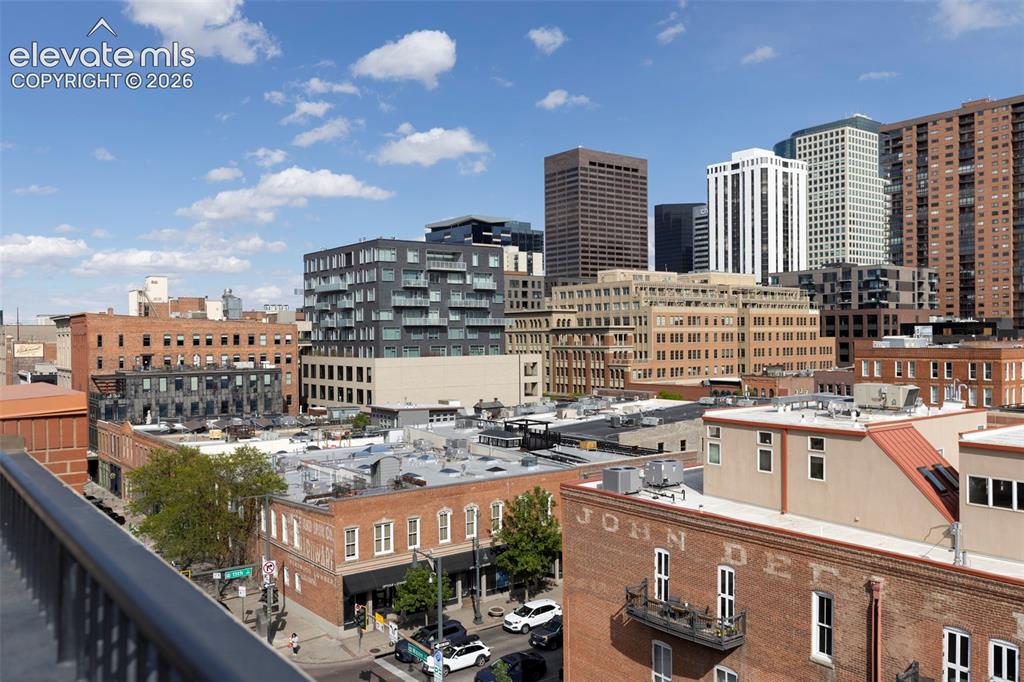 Image 23 of 33: Urban skyline featuring diverse architectural styles and brick buildings