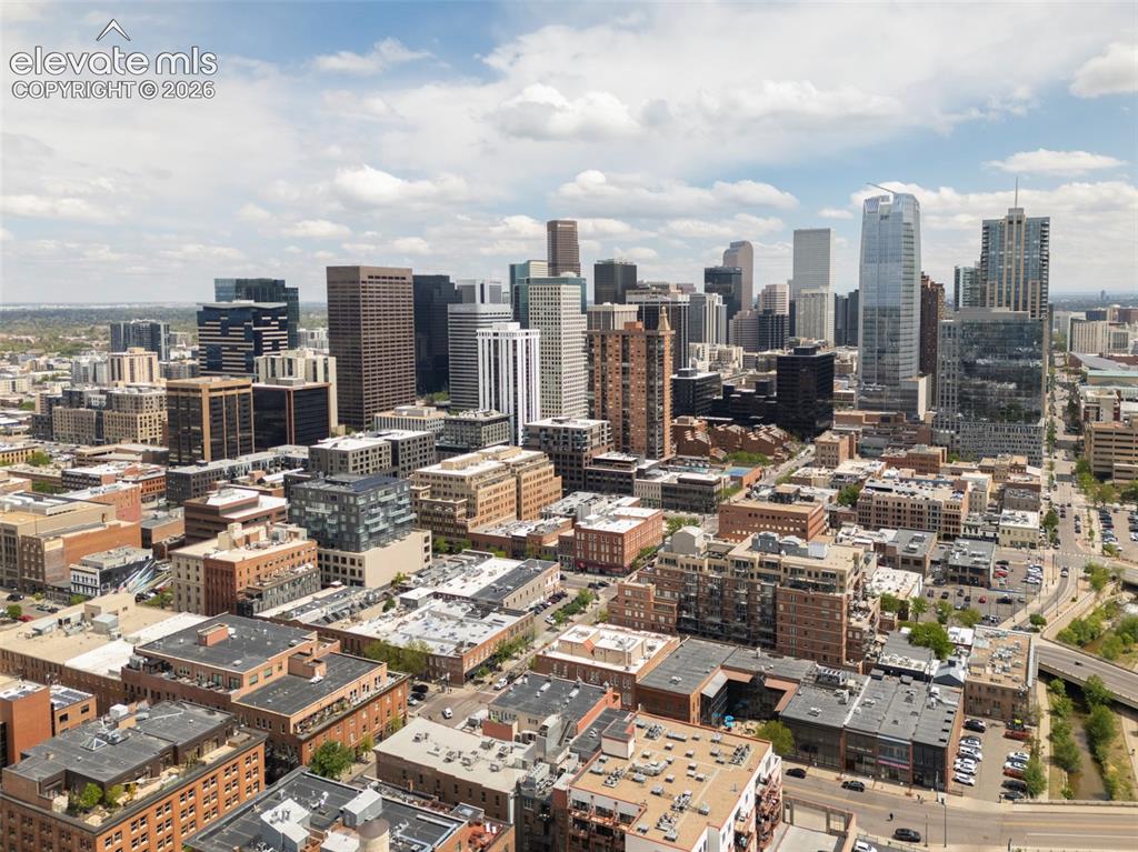 Image 33 of 33: Expansive urban landscape featuring a mix of modern high-rise buildings and