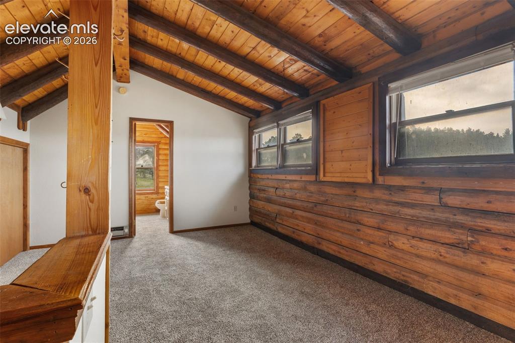 Image 16 of 32: Spacious upper loft provides flexible space for a retreat, office, hobby ar