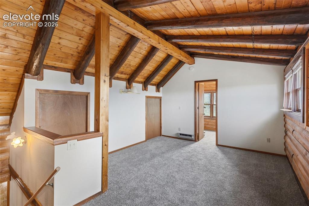 Image 17 of 32: Previously used as a primary suite, the loft features new carpet and overlo