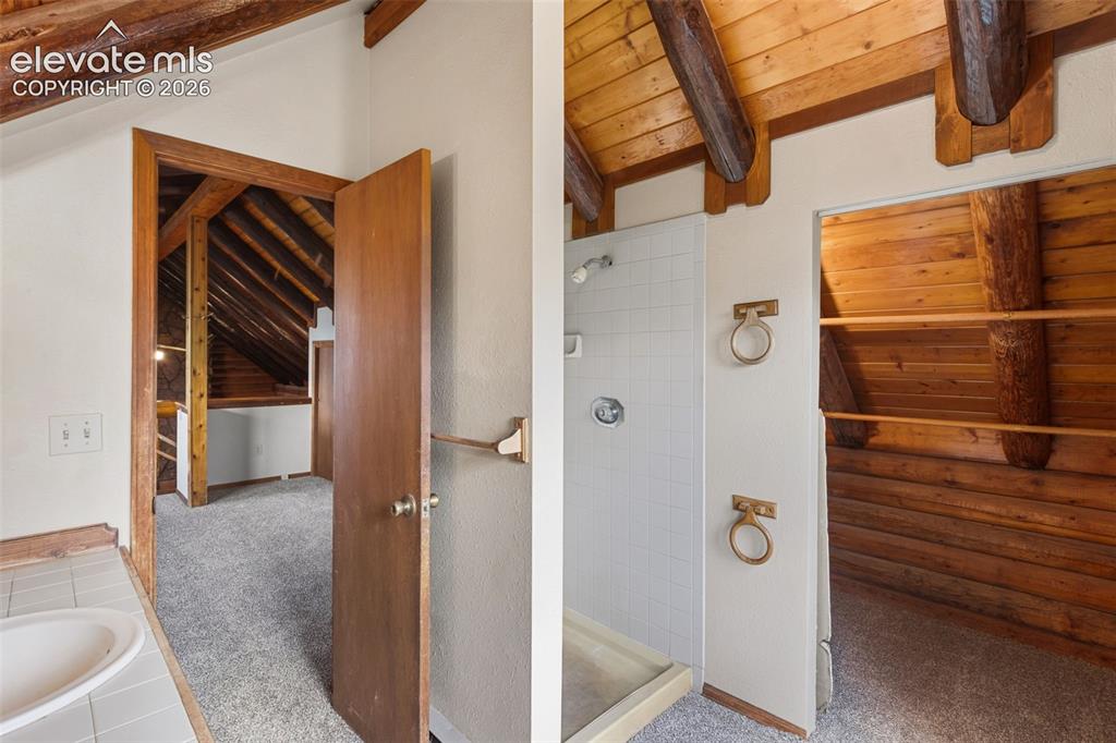 Image 19 of 32: Upper level bathroom conveniently located off the loft.
