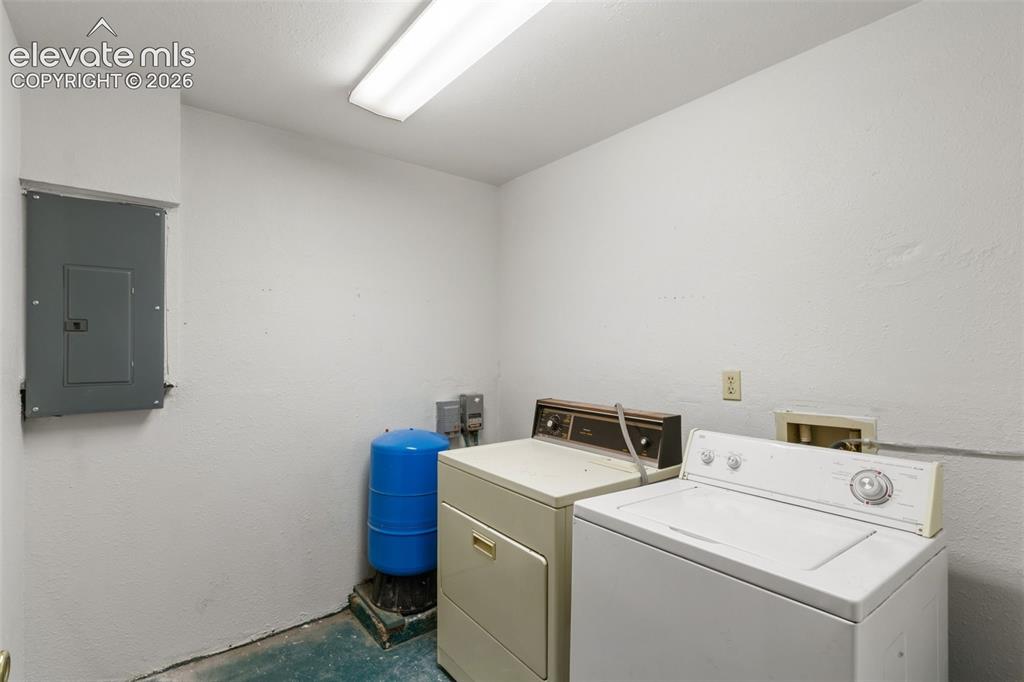 Image 22 of 32: Finished basement laundry room provides dedicated space away from the main