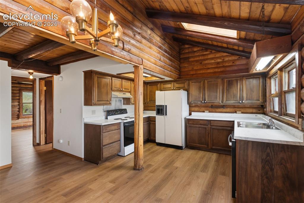 Image 7 of 32: Updated lower cabinetry and countertops complement the home