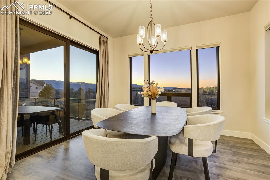 Image 11 of 50: Dining framed by natural light and open-space views
Moments shared here, j