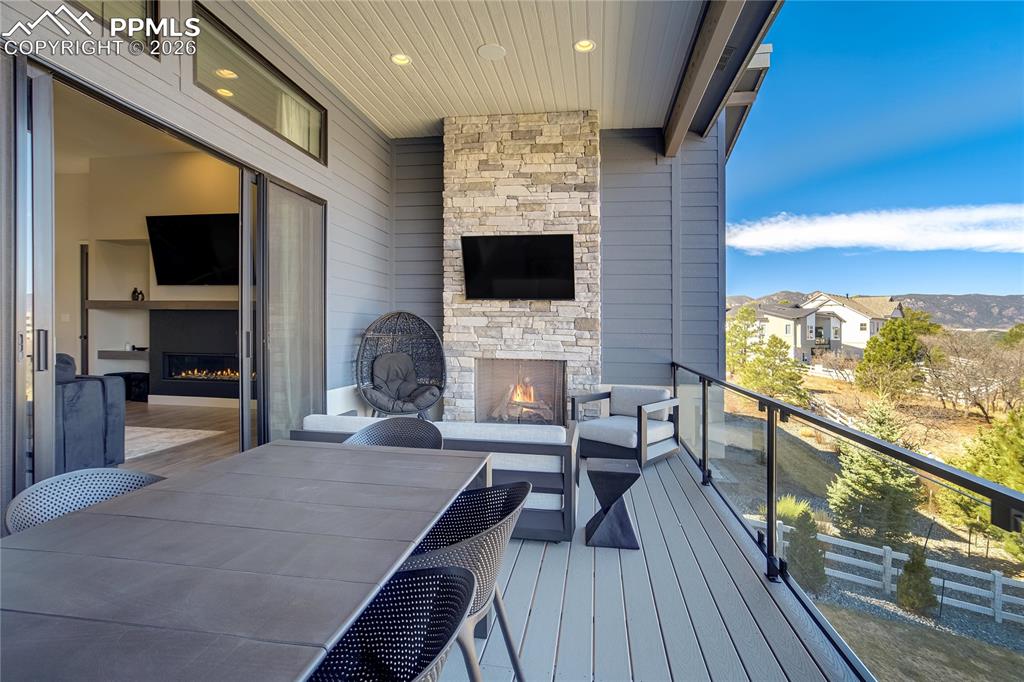 Image 15 of 50: Indoor and outdoor living connected through expansive sliding glass doors
