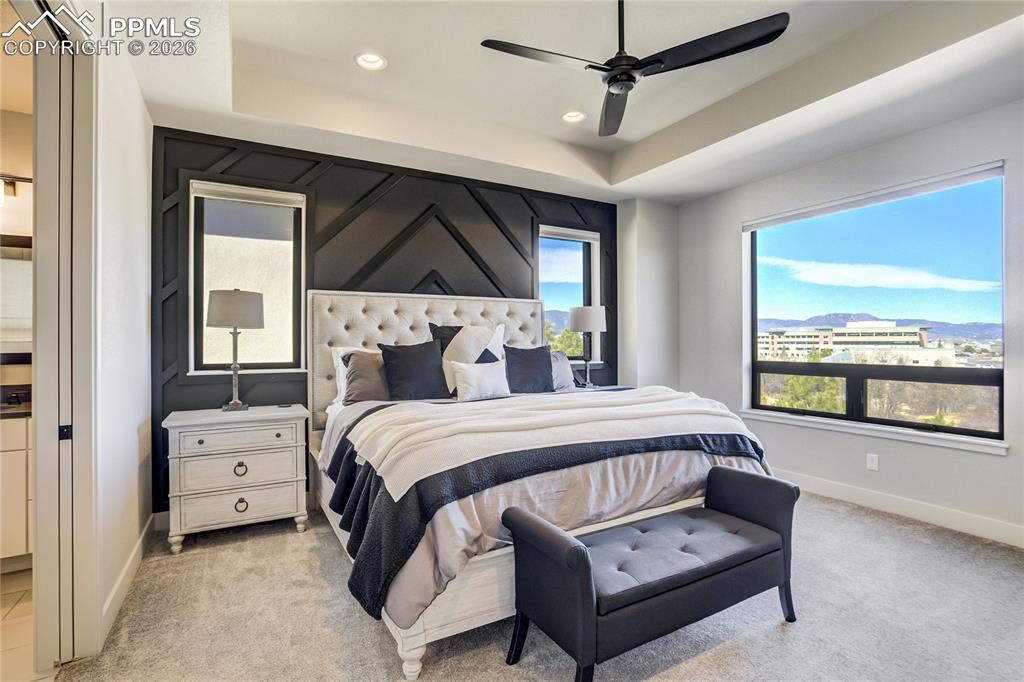 Image 17 of 50: A main-level retreat overlooking open space and quiet landscape
