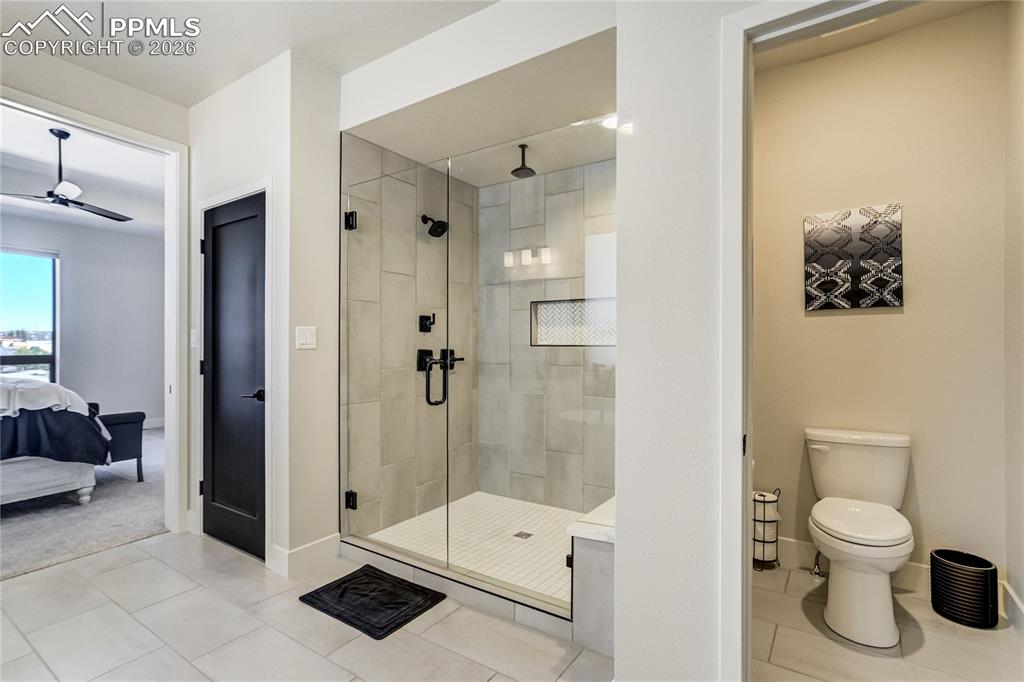 Image 20 of 50: Zero entry walk in shower with 3 shower heads and bench seat 