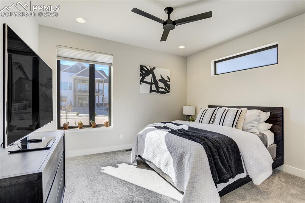 Image 22 of 50: A private main-level suite offering comfort, light and its own ensuite bath