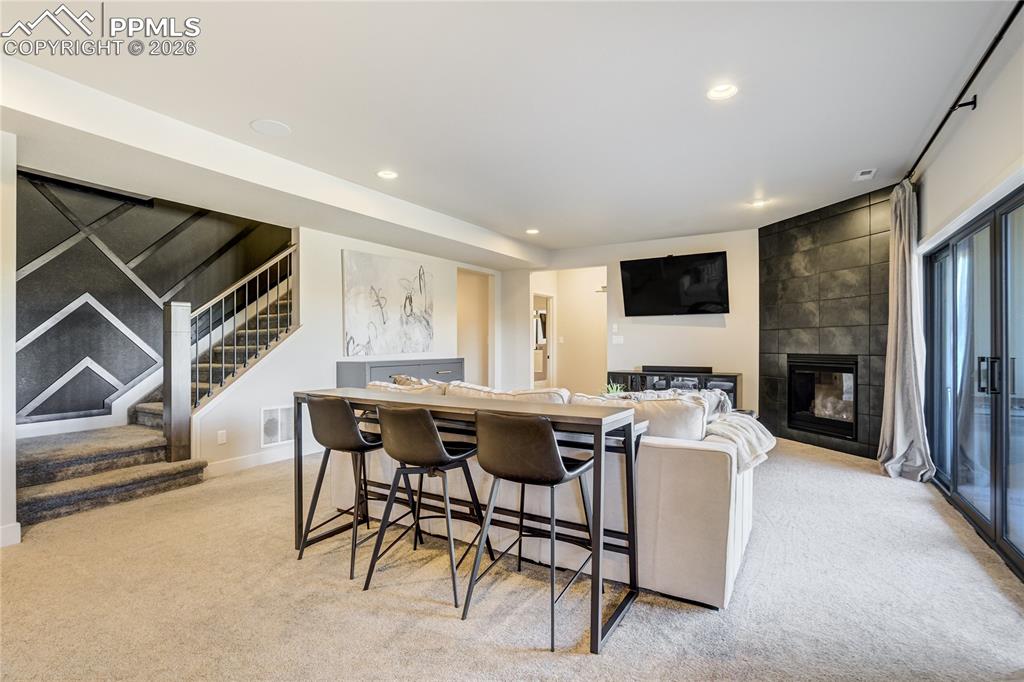 Image 26 of 50: A walk-out lower level with 9