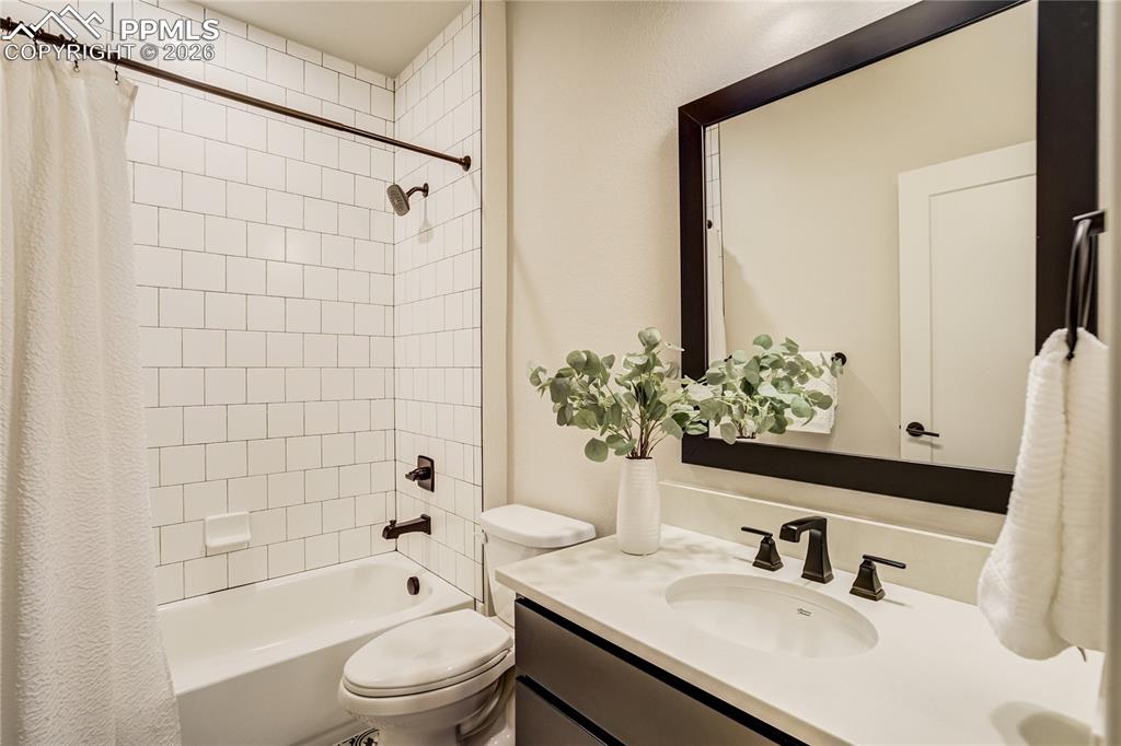 Image 38 of 50: Private ensuite bath with clean-lined finishes, subway tile surround and a 