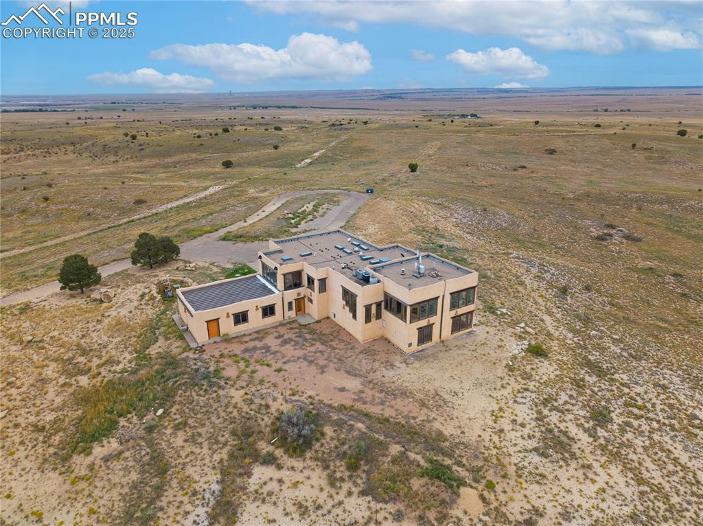 Image 4 of 31: Aerial view of sparsely populated area featuring a desert landscape