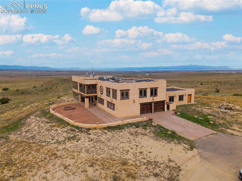 Image 6 of 31: View of subject property featuring a mountainous background