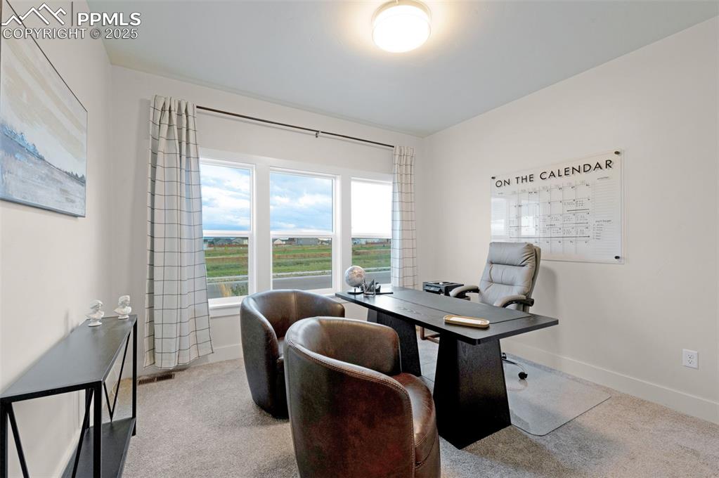 Image 14 of 42: Office featuring light colored carpet and baseboards