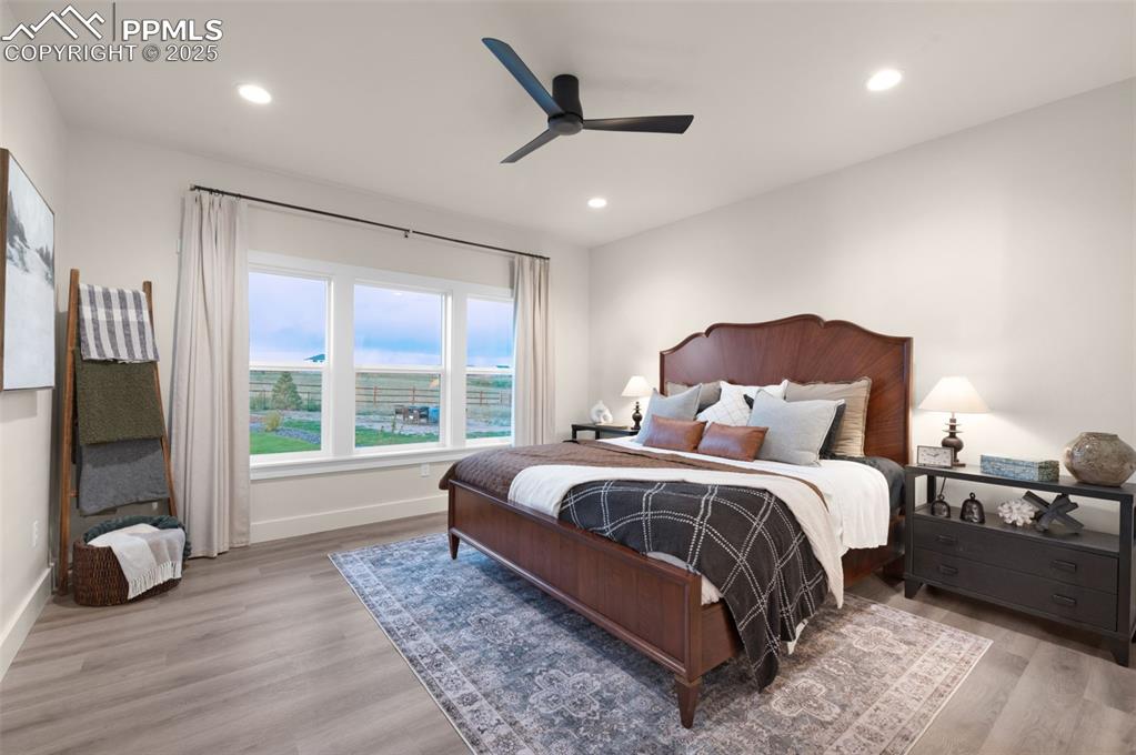 Image 18 of 42: Bedroom with light wood-type flooring, ceiling fan, and recessed lighting