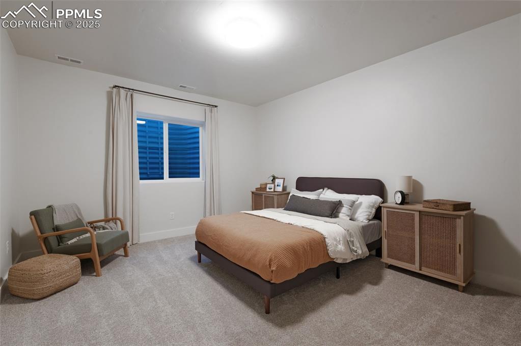 Image 34 of 42: Bedroom featuring light carpet and baseboards