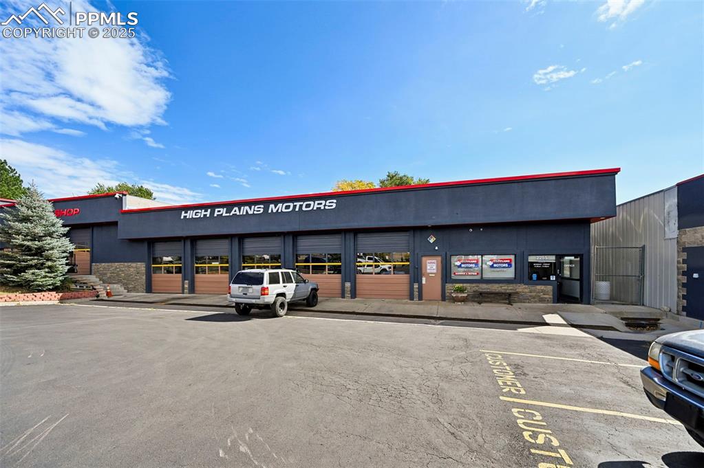 Caption: View of commercial property with community garages