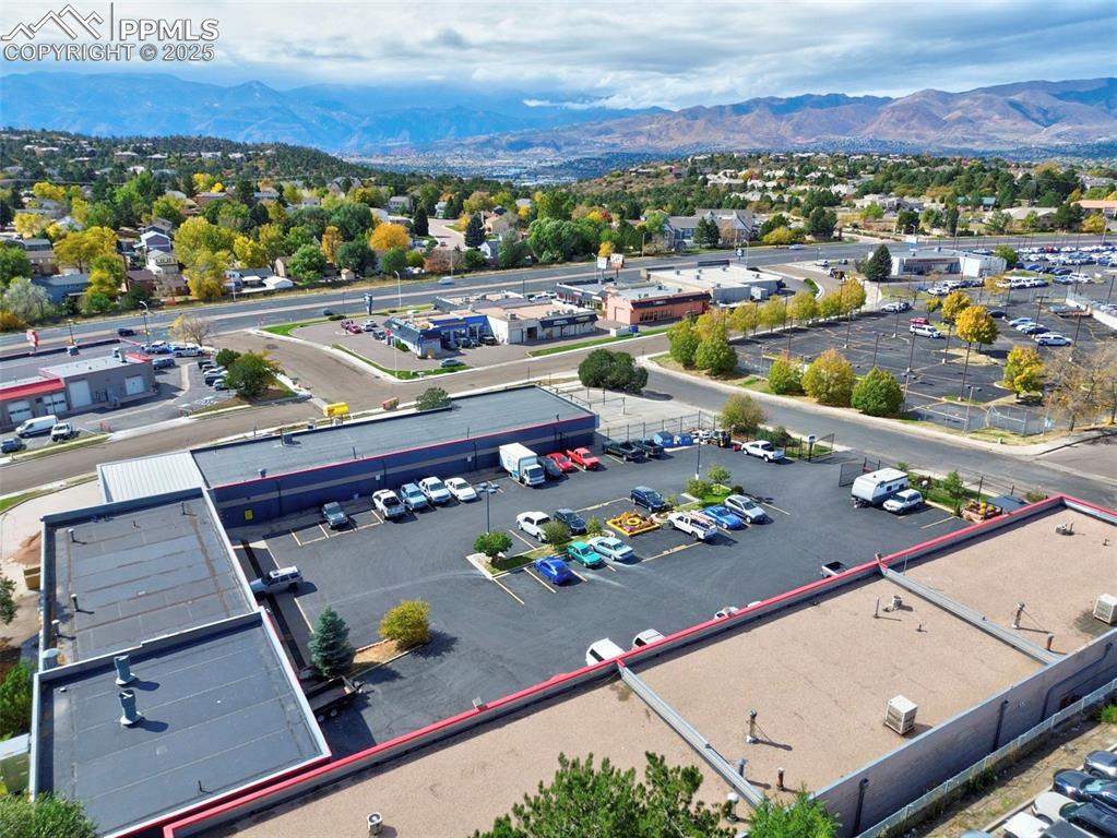 Image 11 of 13: View of property location with a mountain backdrop and property boundaries