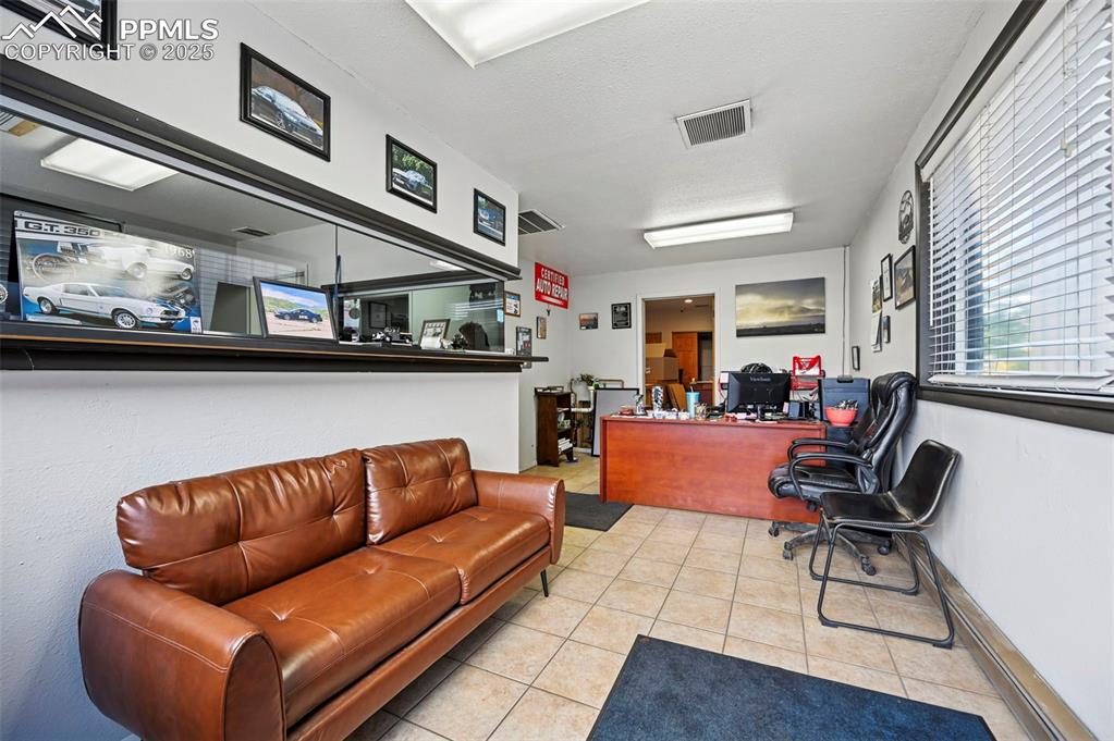 Image 3 of 13: Office featuring a textured ceiling