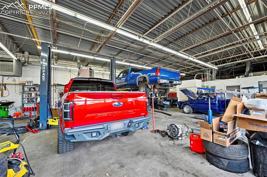 Image 5 of 13: Garage featuring a heating unit
