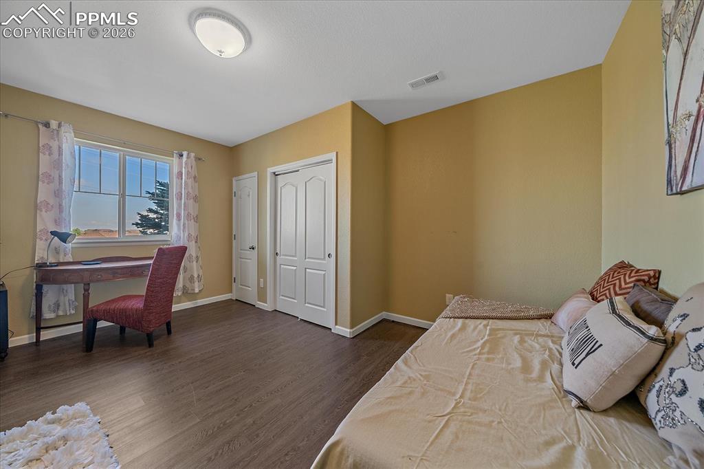 Image 31 of 47: Bedroom in basement featuring luxury vinyl flooring and baseboards