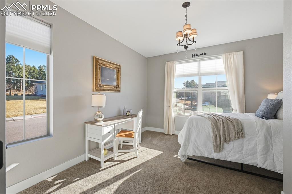 Image 22 of 40: Secondary bedroom upstairs with custom lighting!