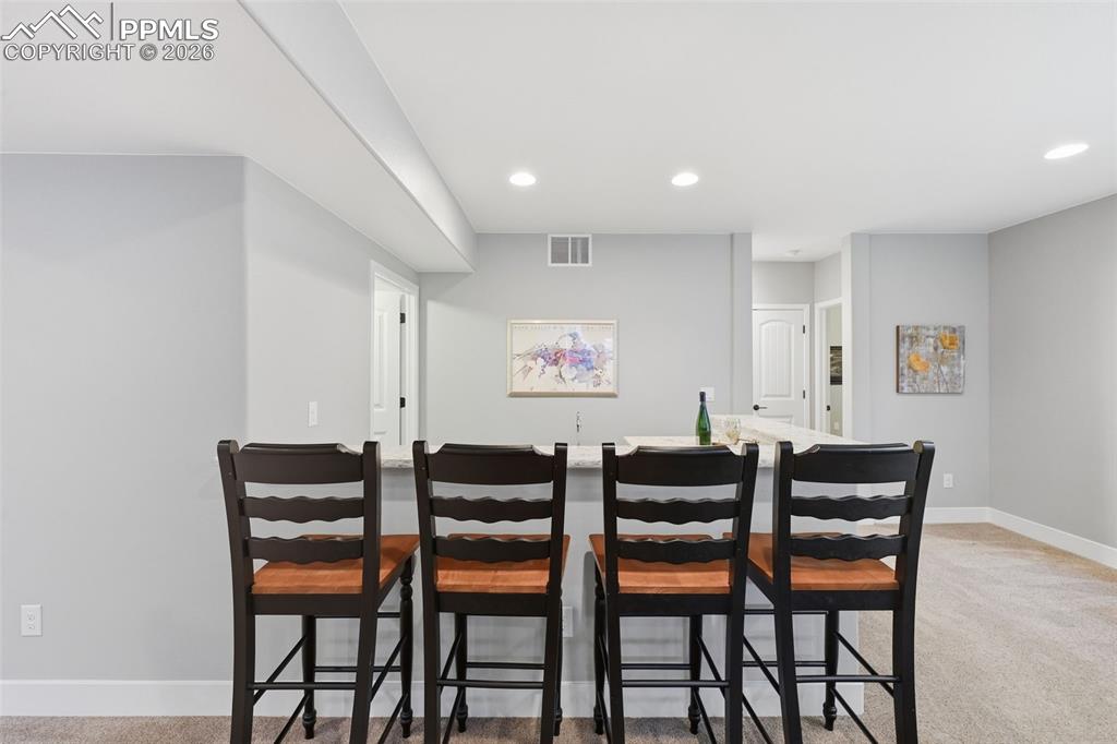 Image 28 of 40: Wet bar in the basement 