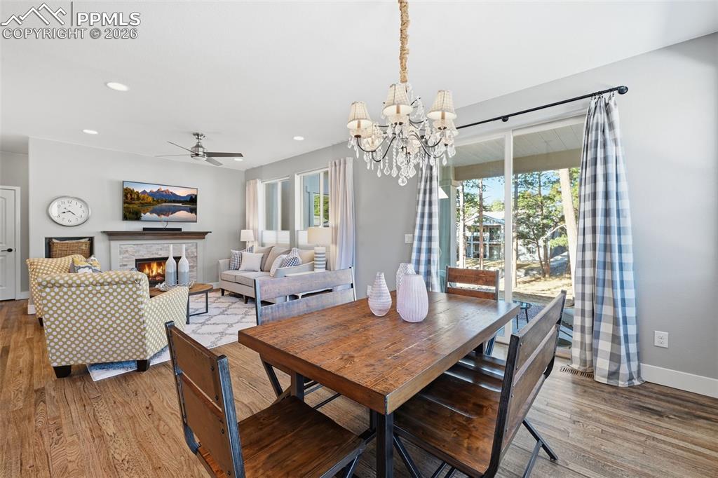 Image 9 of 40: Wonderful dining area with walk out to your patio and treed open space!