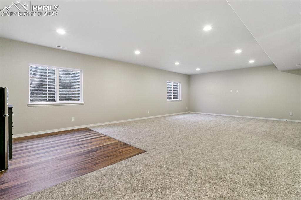 Image 24 of 50: Massive family room roughed in for a wet bar and ready for your personaliza
