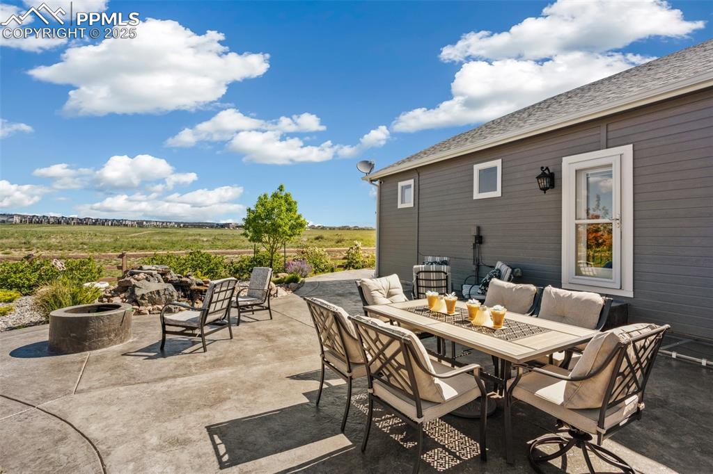 Image 36 of 50: Step out from the kitchen to the patio