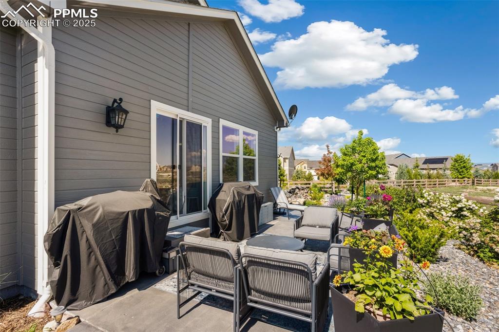 Image 38 of 50: Step out from the living room to the patio