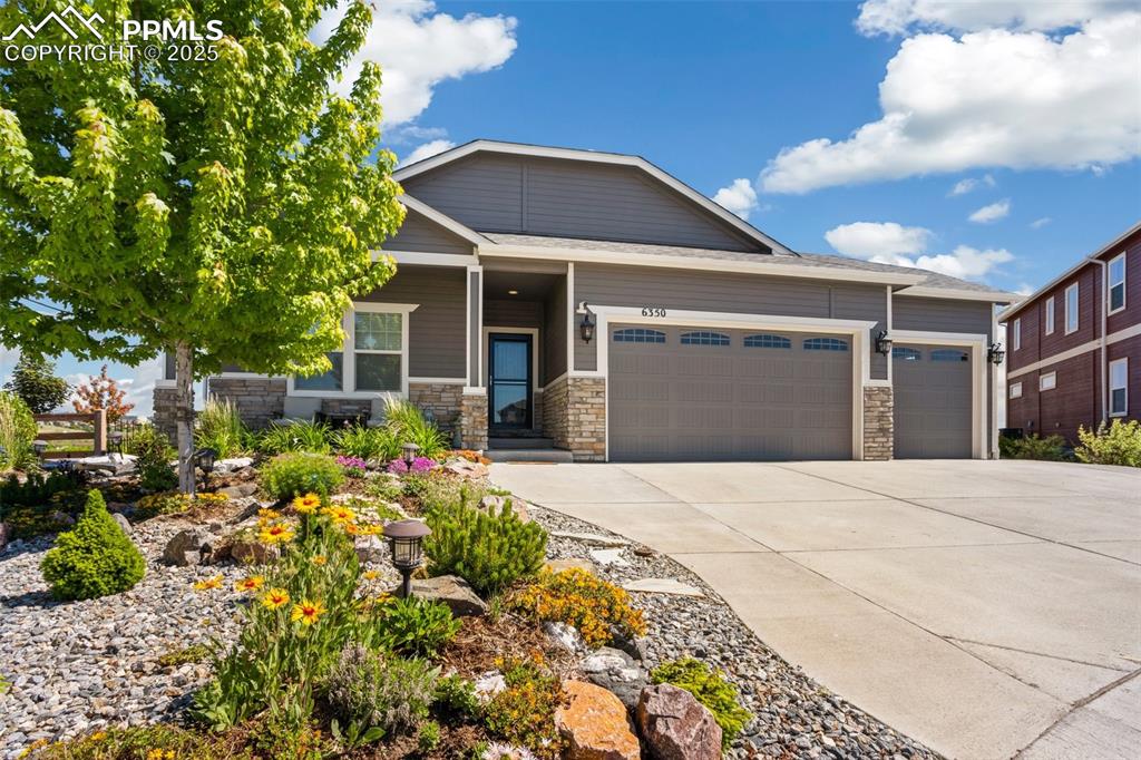 Image 4 of 50: Magnificent landscaping gives this home great curb appeal