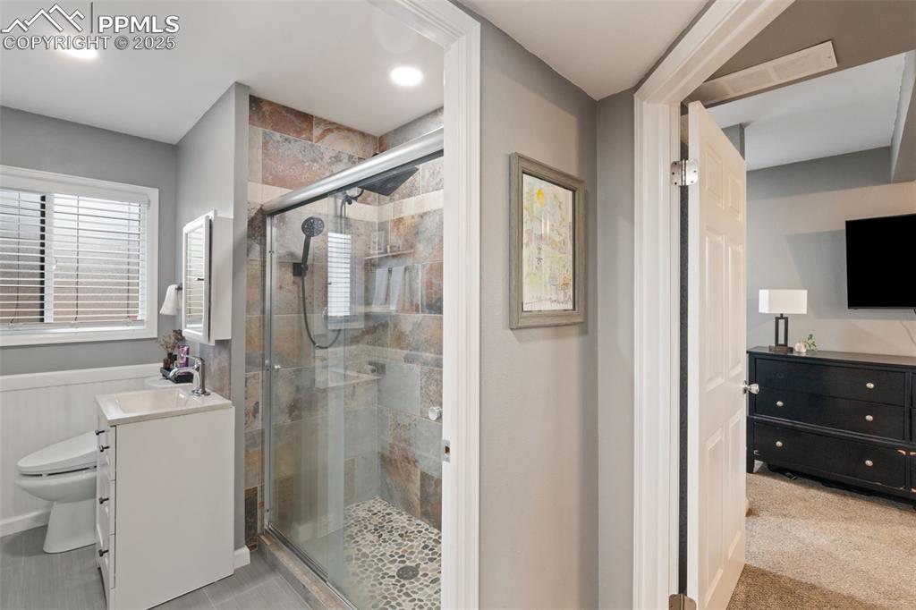 Image 16 of 34: UPDATED HALL BATHROOM