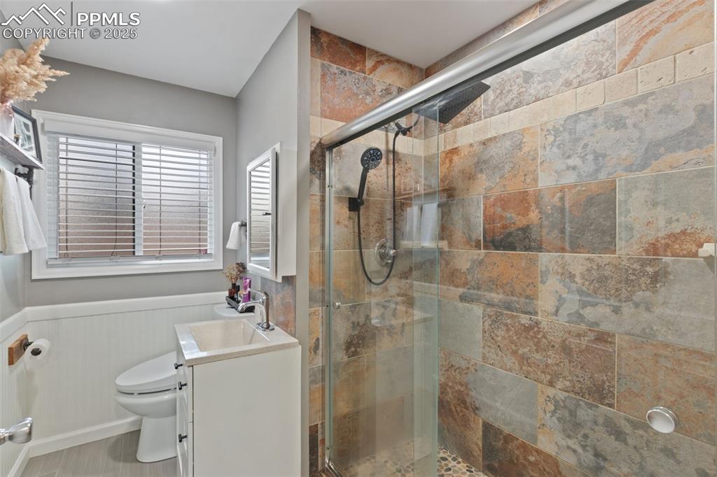 Image 17 of 34: HALL BATH HAS LARGE SHOWER