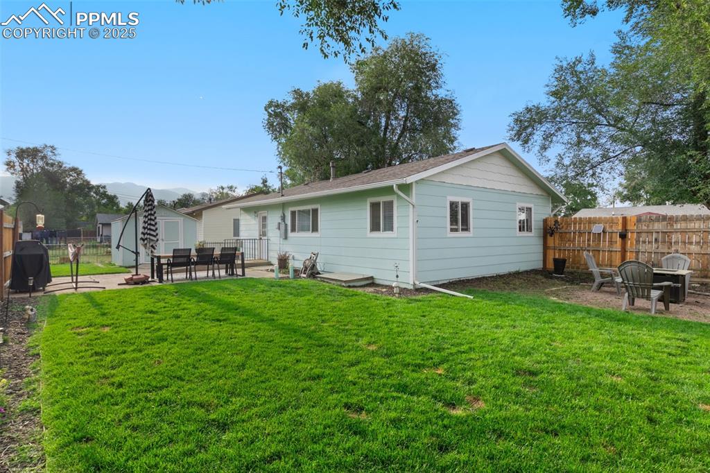 Image 24 of 34: NICELY LANDSCAPED & FENCED BACKYARD