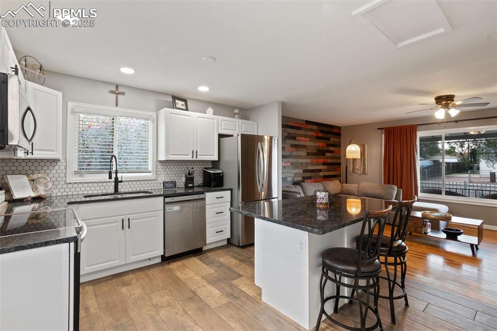 Image 7 of 34: KITCHEN HAS STAINLESS STEEL APPLIANCES