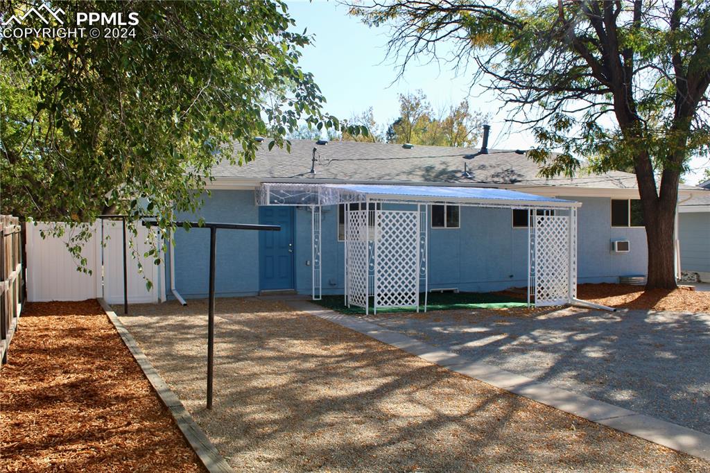 Image 30 of 30: Back of property with a patio area