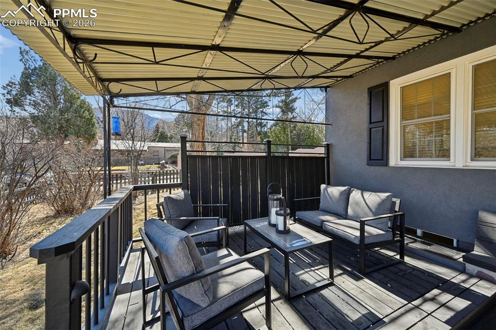 Image 9 of 48: patio and deck off dining room french doors