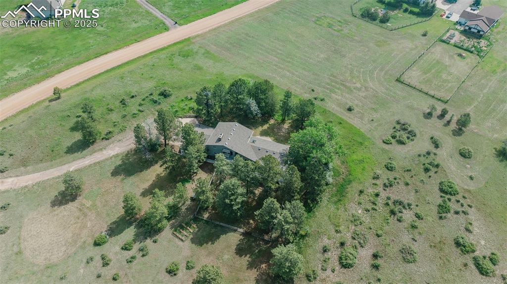 Image 43 of 46: Aerial view of property and surrounding area featuring rural landscape