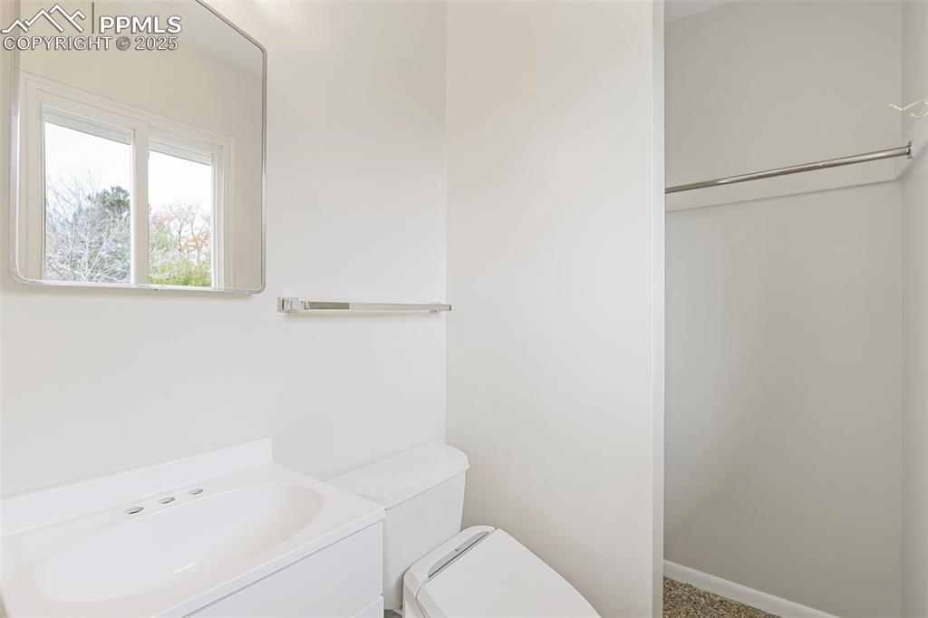 Image 11 of 35: Bathroom featuring vanity and toilet