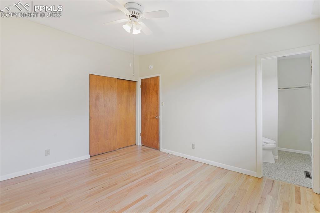 Image 17 of 35: Unfurnished bedroom featuring light wood-style flooring, connected bathroom