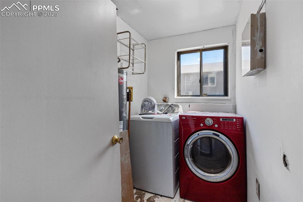 Image 20 of 36: Laundry area with washing machine and dryer