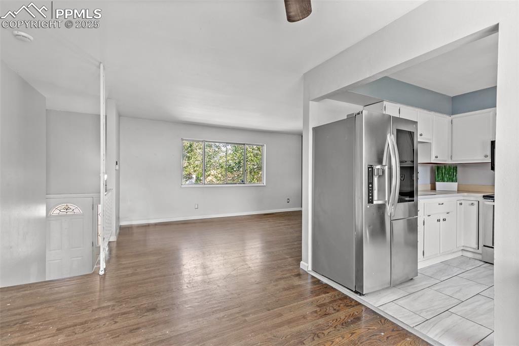 Image 3 of 36: Entryway to upper living room and kitchen