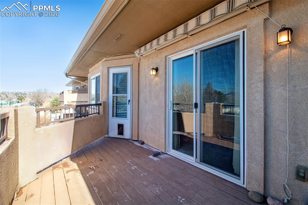 Image 29 of 33: Back Deck - Connects to the Kitchen and Primary Bedroom