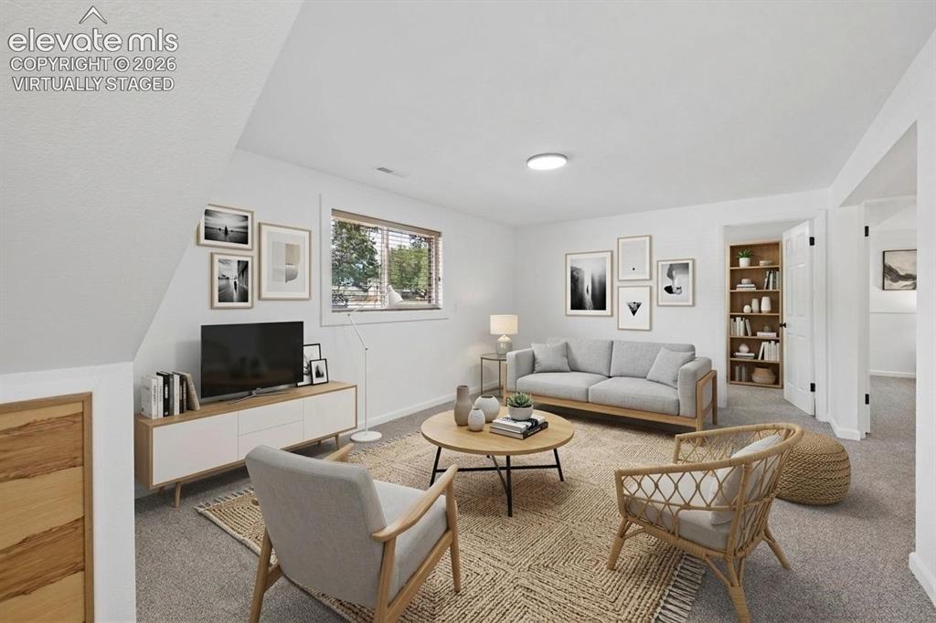 Image 21 of 42: Family room, virtually staged