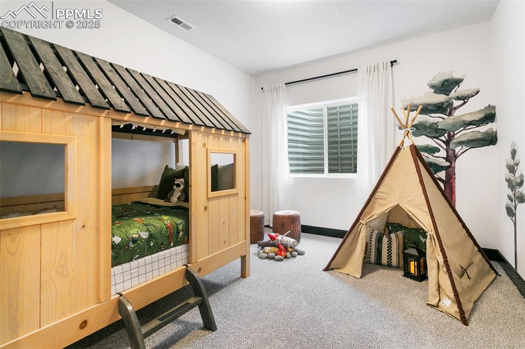 Image 19 of 22: Recreation room with carpet floors and baseboards
