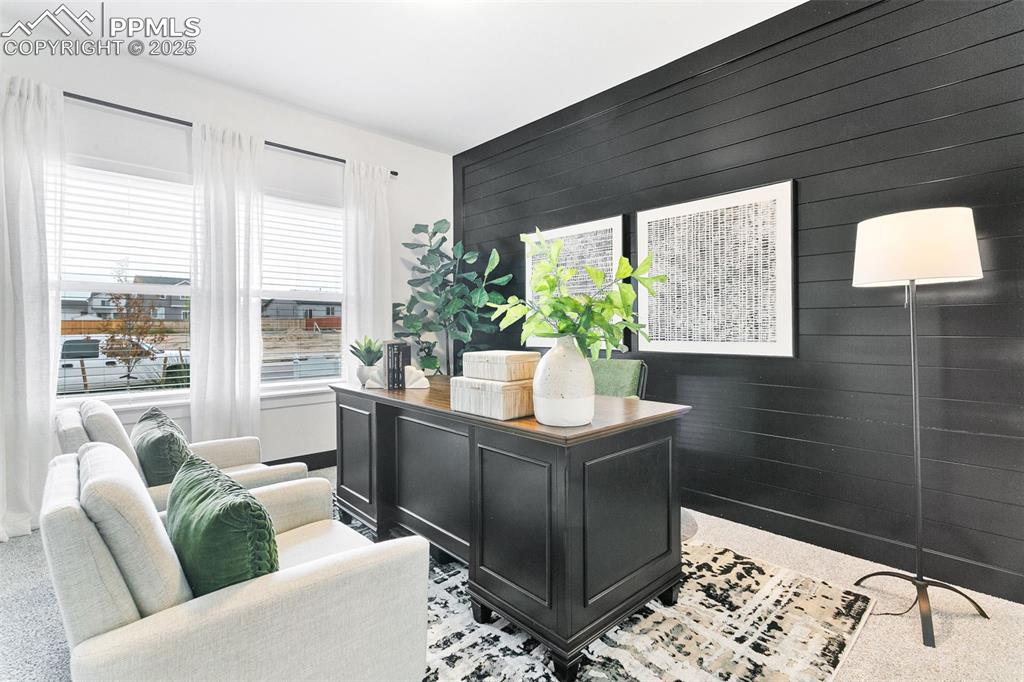 Image 2 of 22: Office area featuring wooden walls