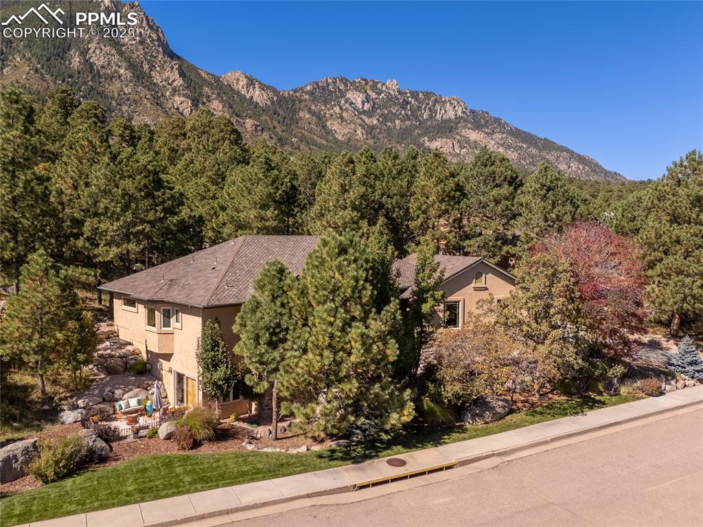 Image 2 of 47: View of mountain background featuring a forest