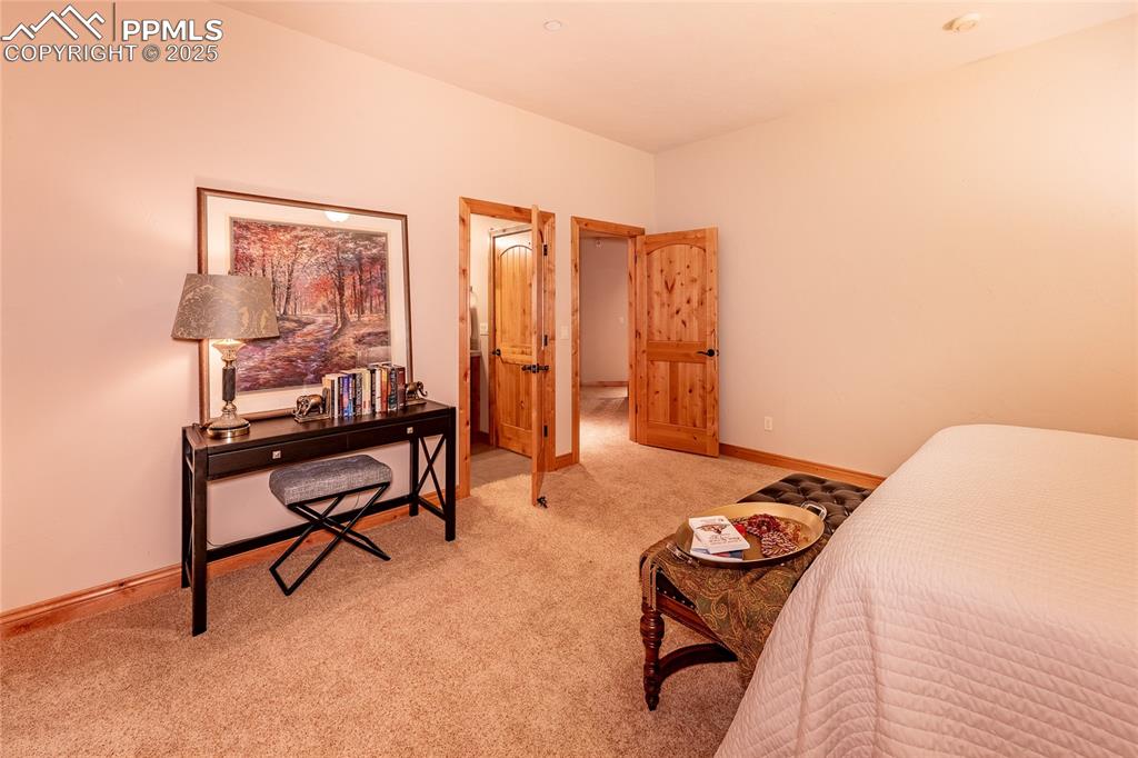 Image 22 of 47: Bedroom with carpet flooring and baseboards